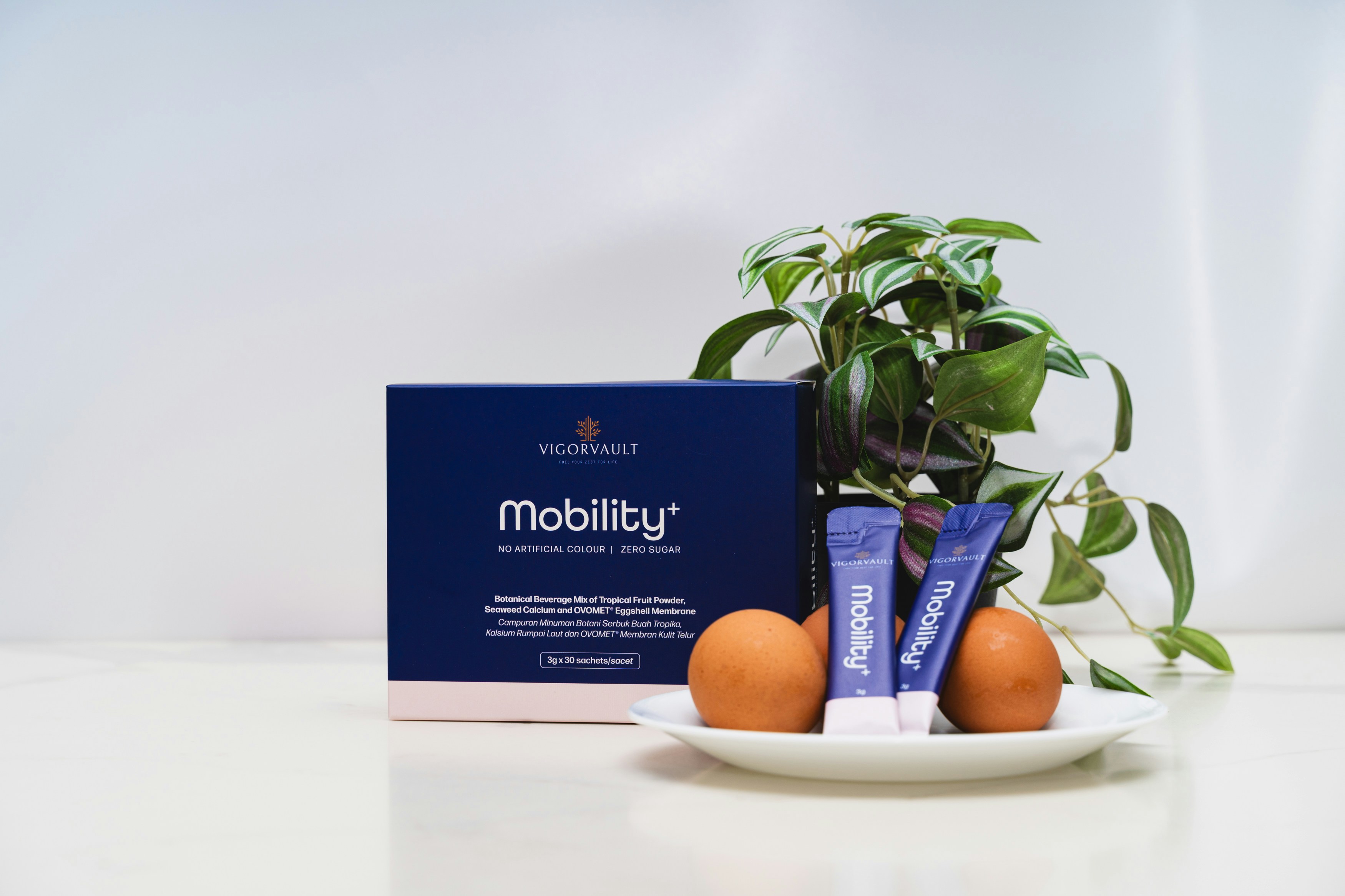 Mobility supplement box with eggs and plant.